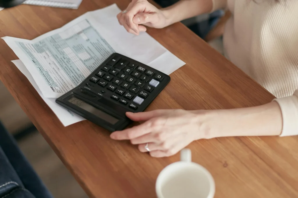 sample image of calculator on desk for topic about what refinancing does