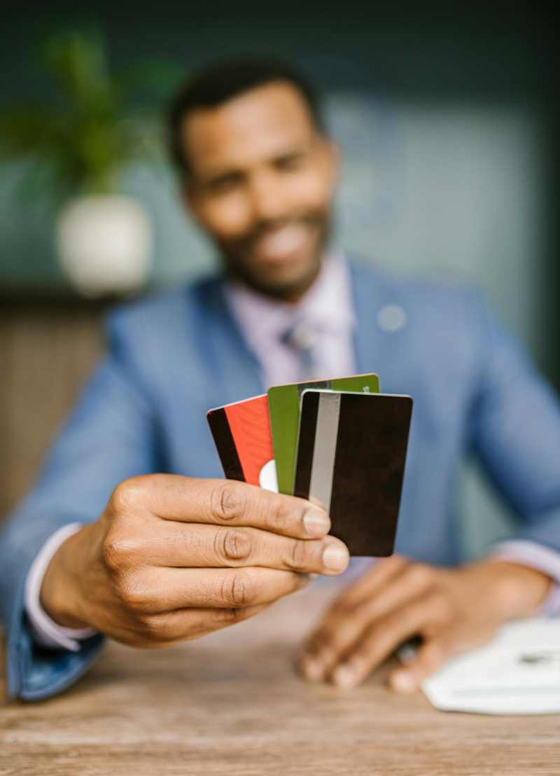 specialist loans in brisbane applicant man holding cards for specialist loans in Brisbane