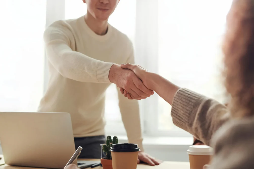 handshake after discussing topic on improving loan approval