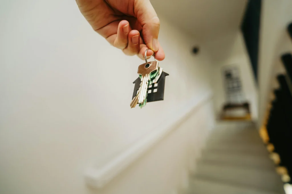 photo of keychain with home design for topic on First Home Buyer Loan Guide