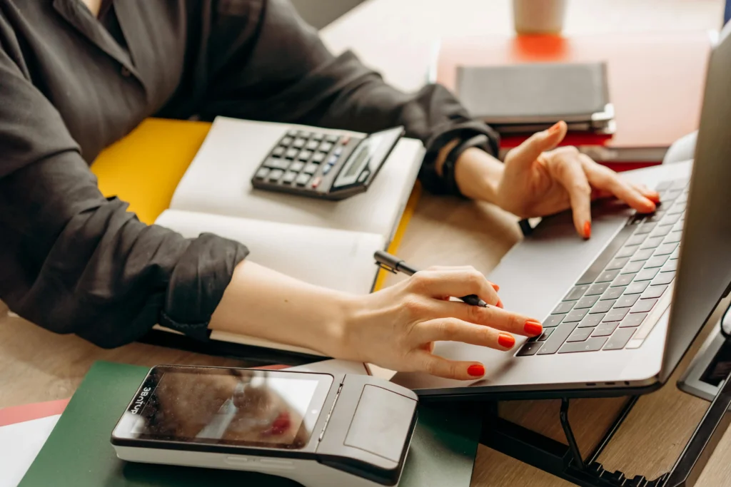 photo of a calculator with laptop for topic on specialist lenders for bad credit borrowers