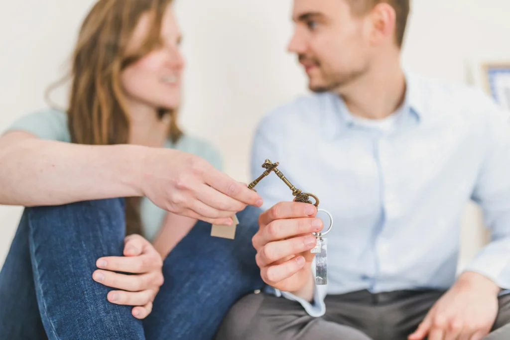 couple holding keys after loan approved for their home loan application
