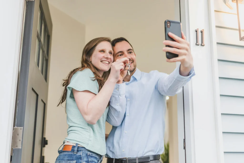 sample image of couple happy taking picture for topic on first home buyer loan guide