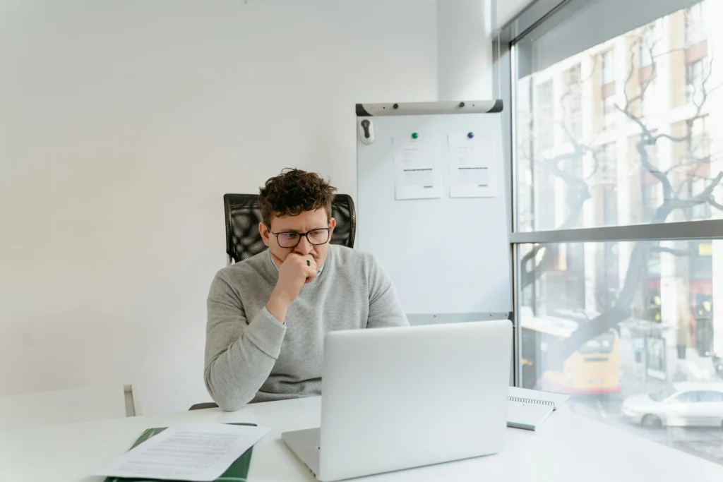 sample image of a man sitting in front of computer for topic on how to improve bad credit