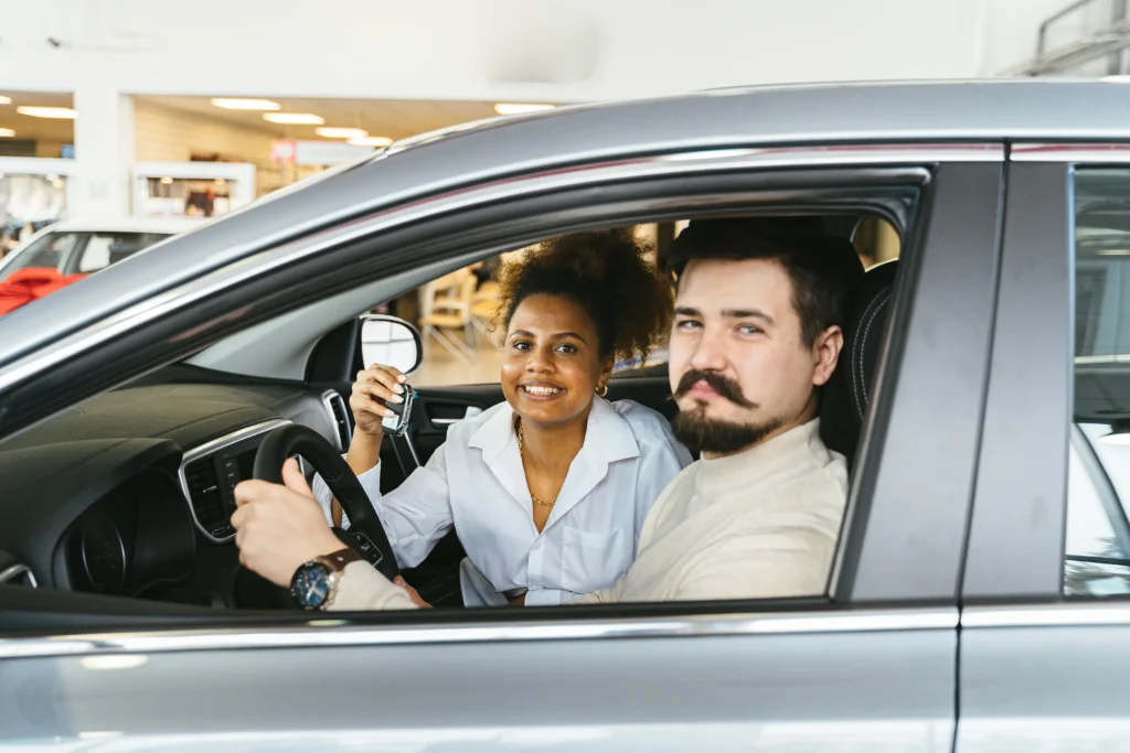 married couple happy inside the car