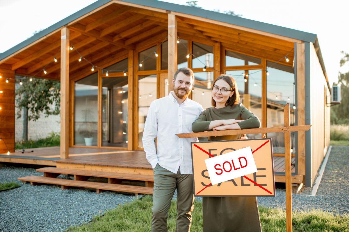 First Home Buyer Stamp Duty QLD - a calculator, coins and a house model showing stamp duty costs