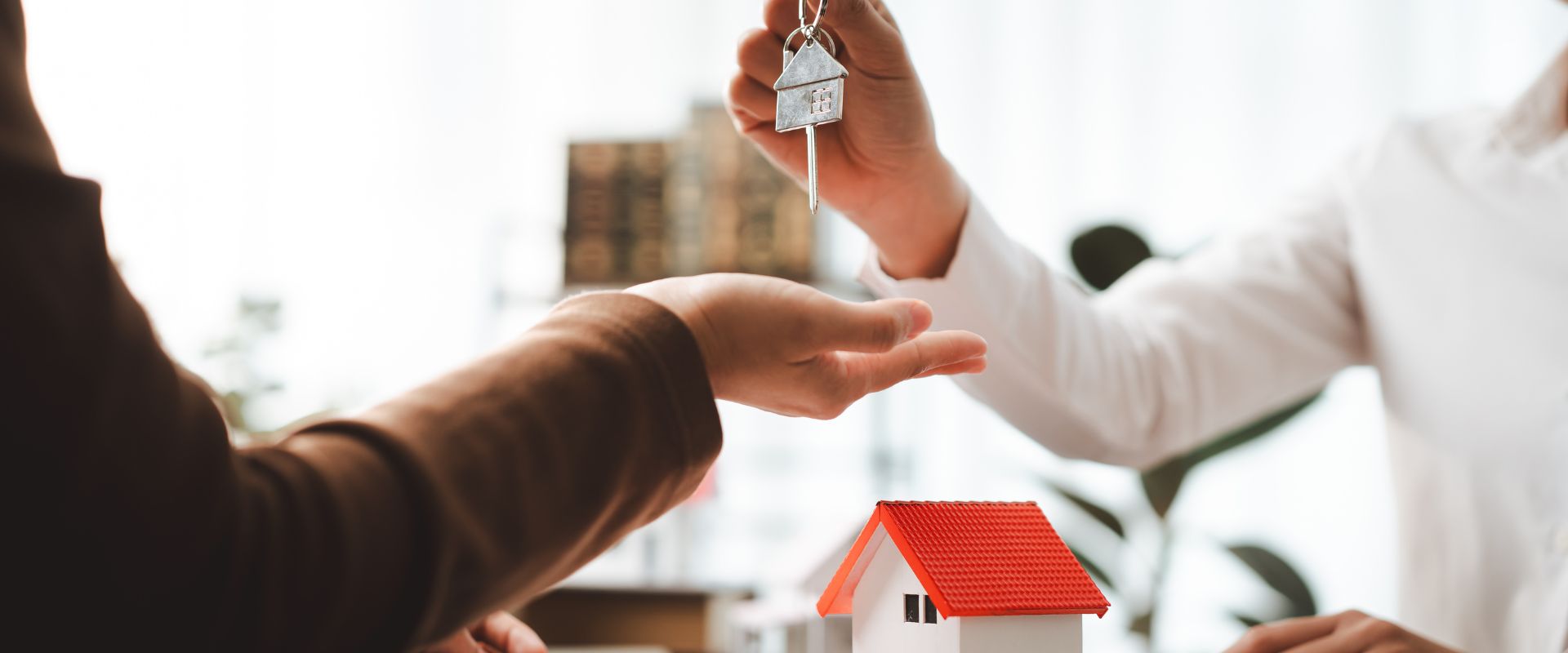 First Home Guarantee Brisbane - a first home guarantee scheme document with a house model and keys