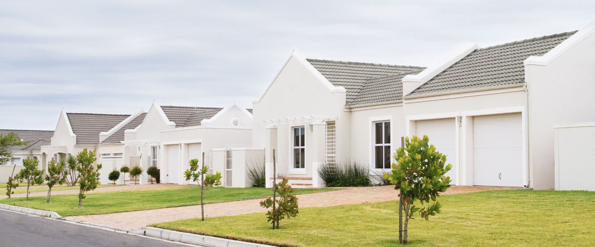 House Deposit Brisbane - a small deposit of coins beside a house model for a minimum deposit home loan